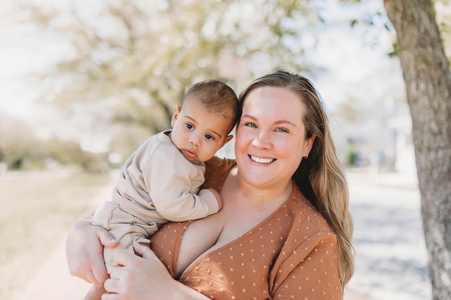 Annie Richardson holding her child on a sunny day