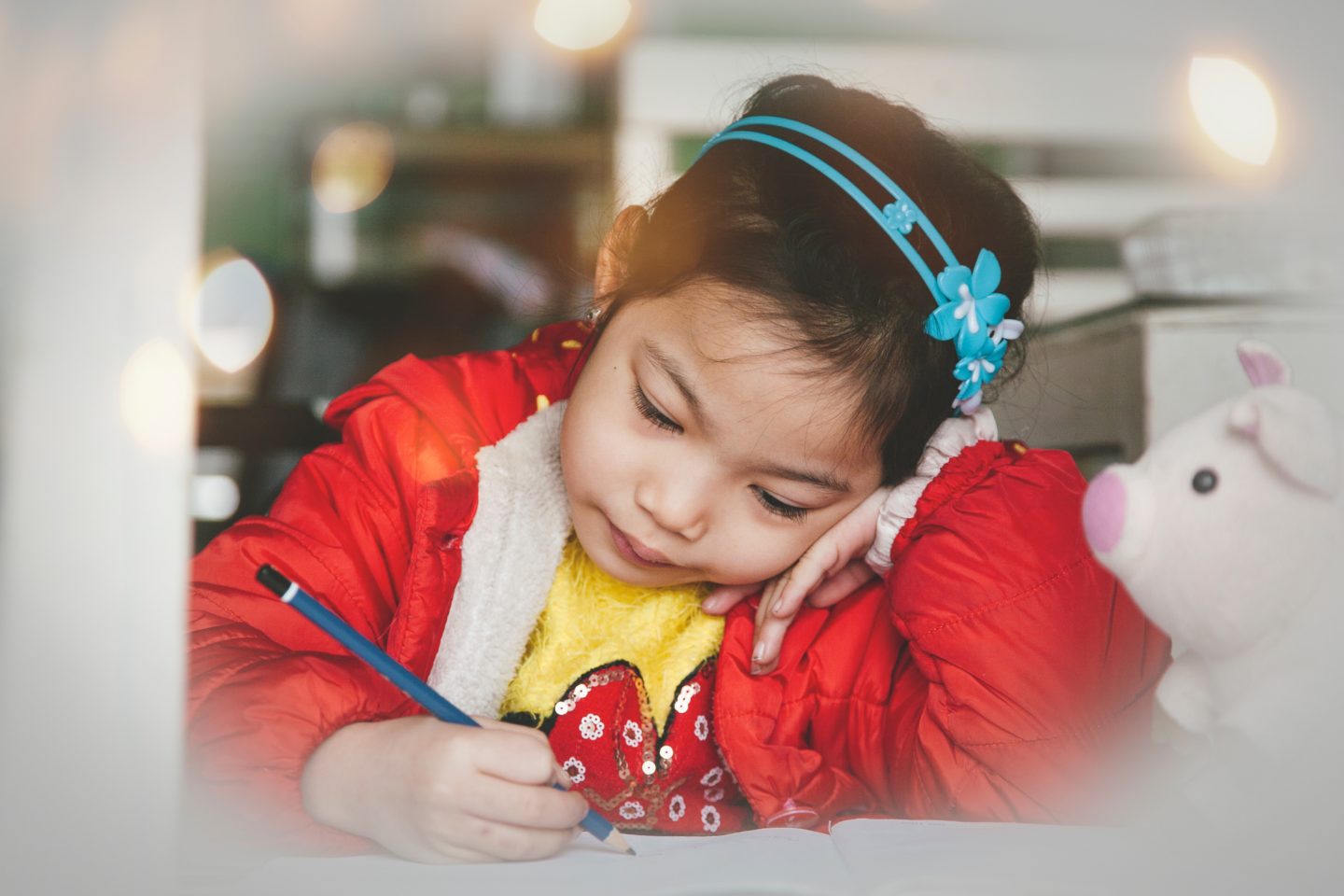 little girl writing a letter